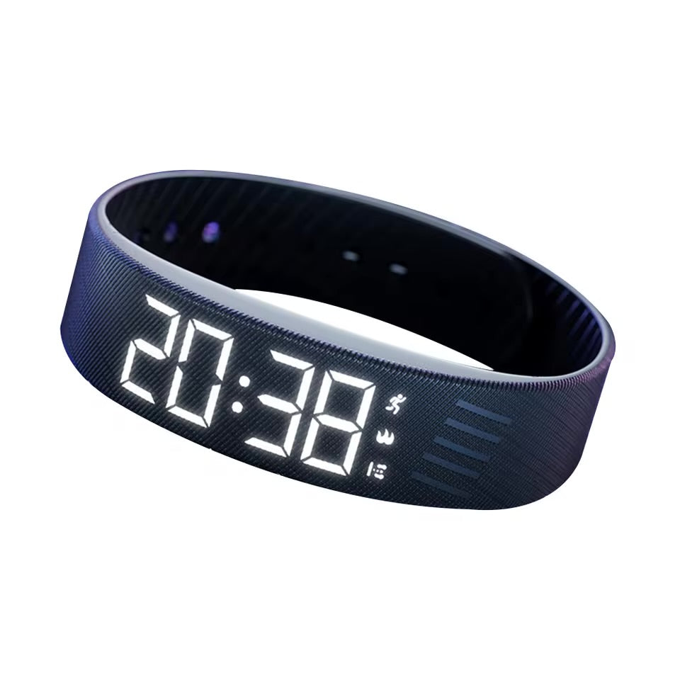 Black vibrating alarm wristband with LED display on white background