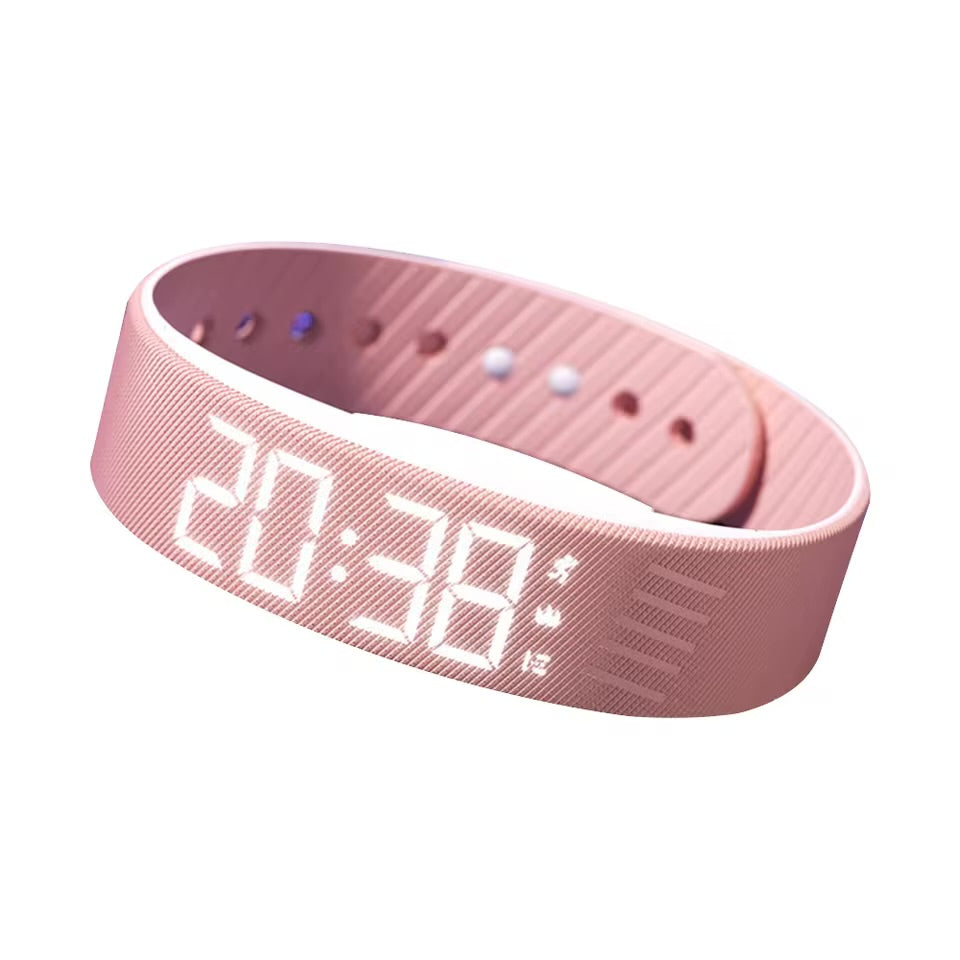 Pink vibrating alarm wristband with LED display on white background