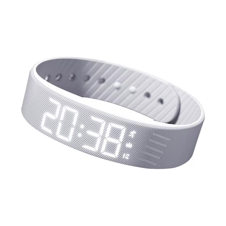 White vibrating alarm wristband with LED display on white background